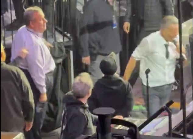 Bruce Springsteen walks past Chris Christie during concert encore, sparking viral debate.