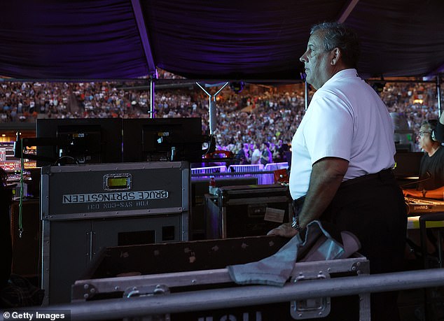 Bruce Springsteen walks past Chris Christie during concert encore, sparking viral debate.