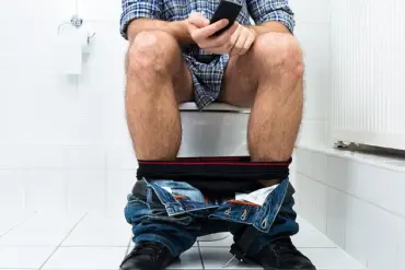 Health Risks of Prolonged Toilet Sitting Highlighted by Medical Experts