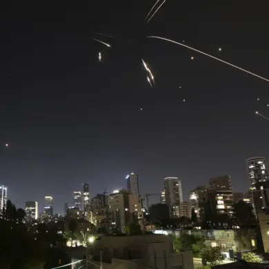 Iranian Attack Sparks Fire in Tel Aviv Suburb, Escalating Tensions with Israel