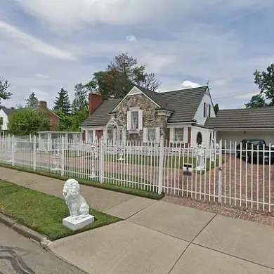 Detroit Man Faces Criminal Charges After Mansion Fire, Sparking Debate on Legal and Regulatory Accountability