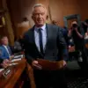 Bipartisan Senate Scrutiny of HHS Secretary's Past Opposition to Trump's Vaccine Rollout Focuses on Credibility and Scientific Integrity